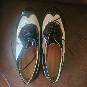 Women's black and white Wingtip shoes size 11.